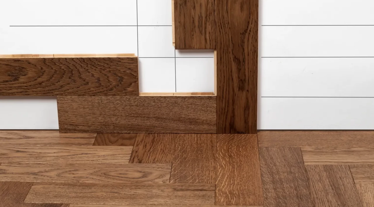 Stop-motion frame — parquet planks placed on the floor and mounted on the wall